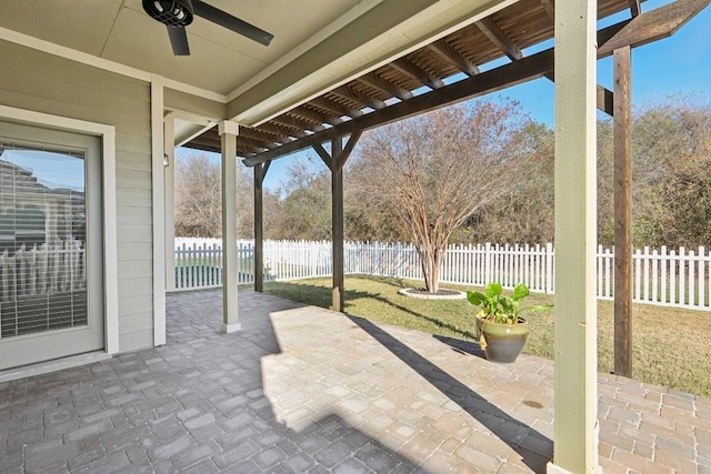 view of patio with ceiling fan and a water view