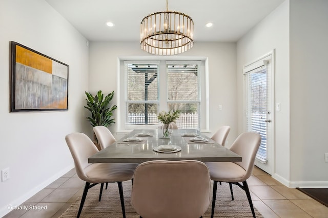 dining room with tile patterned flooring and a notable chandelier