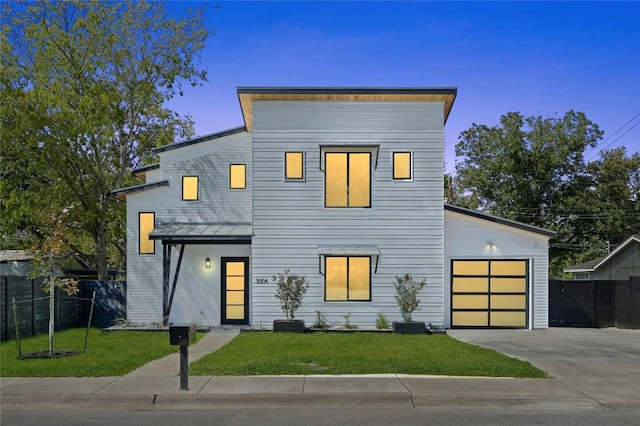 modern home with a garage and a front yard