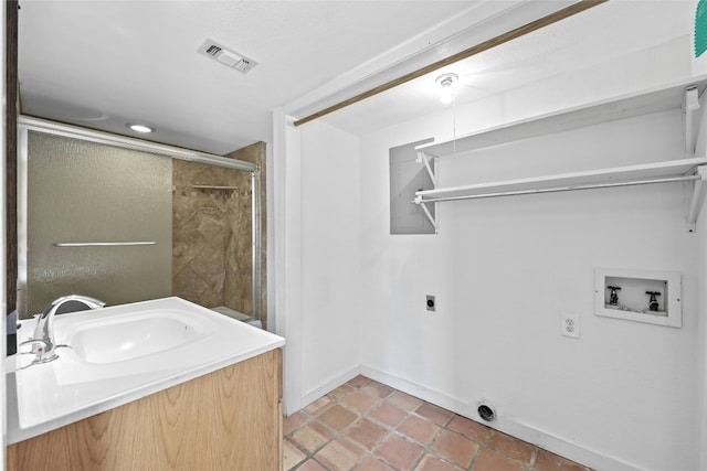 laundry area with washer hookup, electric dryer hookup, and sink