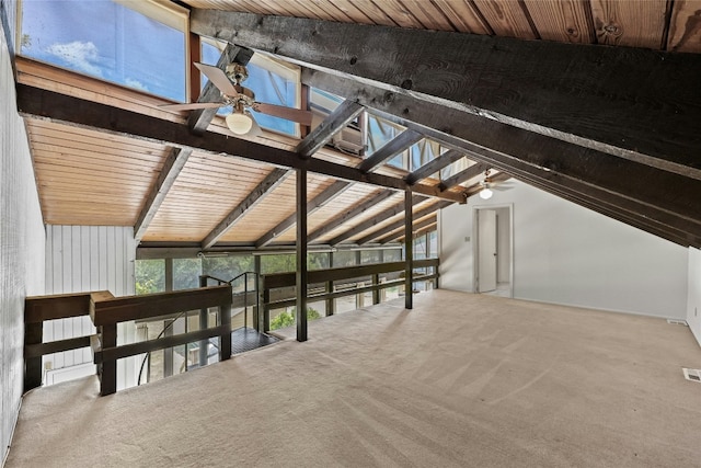 additional living space featuring ceiling fan, carpet floors, lofted ceiling with beams, and wooden ceiling