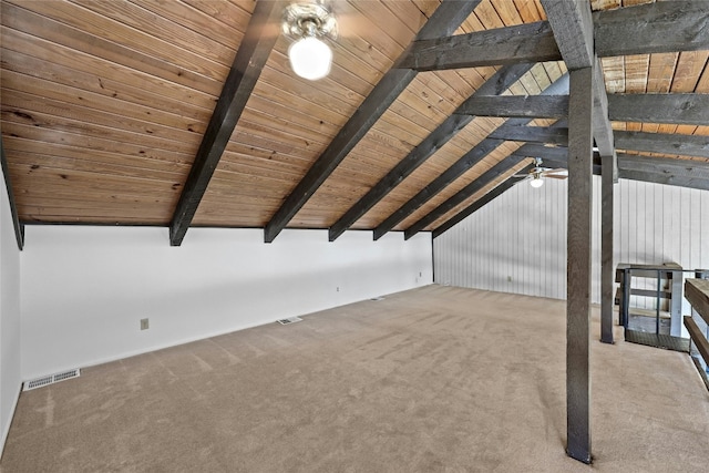 additional living space featuring vaulted ceiling with beams, ceiling fan, carpet, and wood ceiling