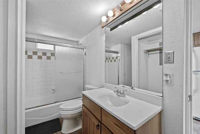 full bathroom featuring vanity, toilet, enclosed tub / shower combo, and a textured ceiling