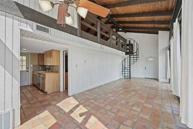 kitchen with stainless steel dishwasher, wood ceiling, ceiling fan, sink, and beam ceiling