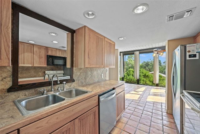 kitchen featuring sink, stainless steel dishwasher, white range with electric stovetop, decorative backsplash, and light tile patterned flooring