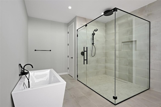 bathroom featuring plus walk in shower and tile patterned floors