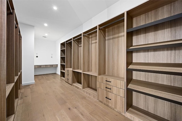 walk in closet featuring light wood-type flooring