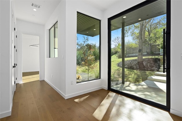 doorway to outside with hardwood / wood-style flooring