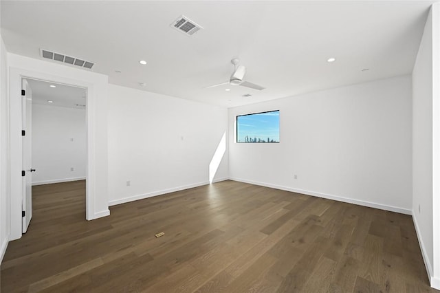 unfurnished room featuring ceiling fan and dark hardwood / wood-style floors