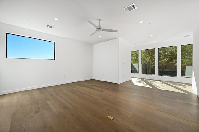 empty room featuring dark hardwood / wood-style floors and ceiling fan