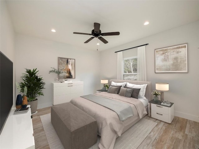 bedroom featuring ceiling fan and light wood-type flooring