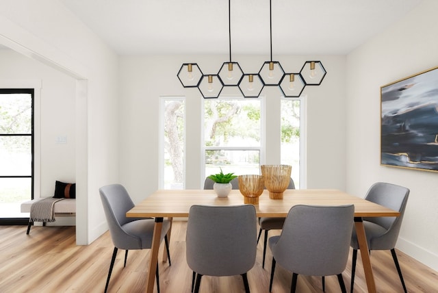 dining area featuring light wood-type flooring