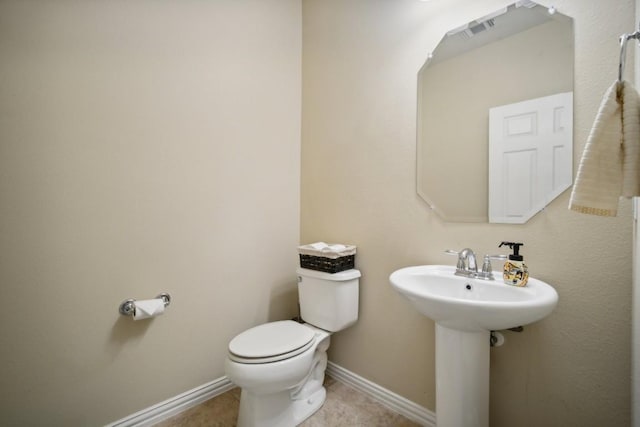 bathroom featuring toilet