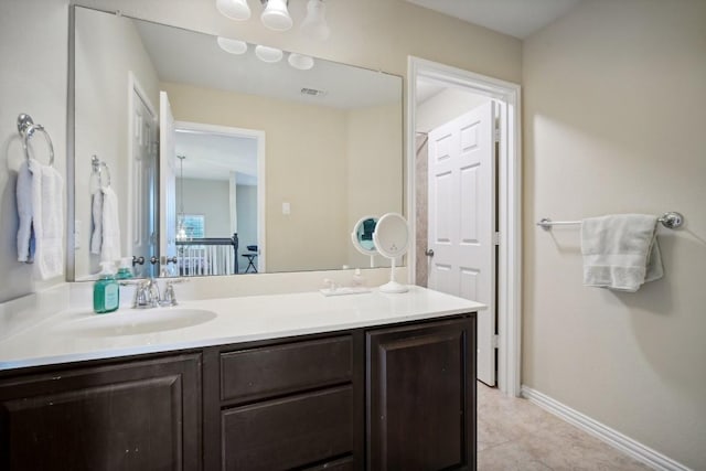 bathroom with tile patterned flooring and vanity