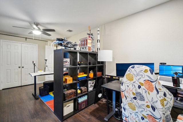 interior space featuring ceiling fan and dark hardwood / wood-style flooring