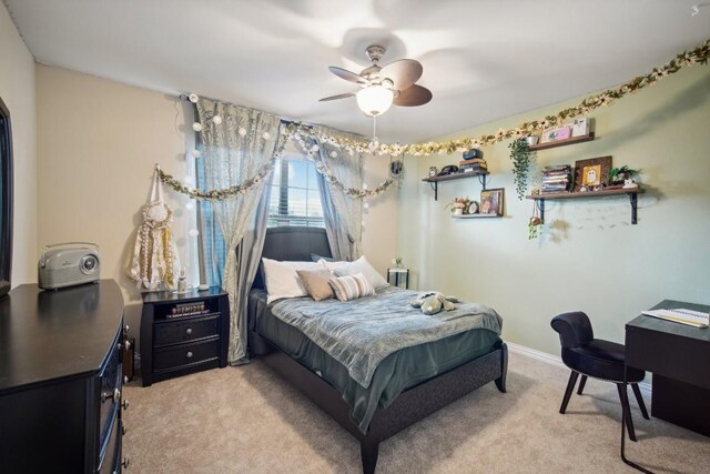 carpeted bedroom with ceiling fan