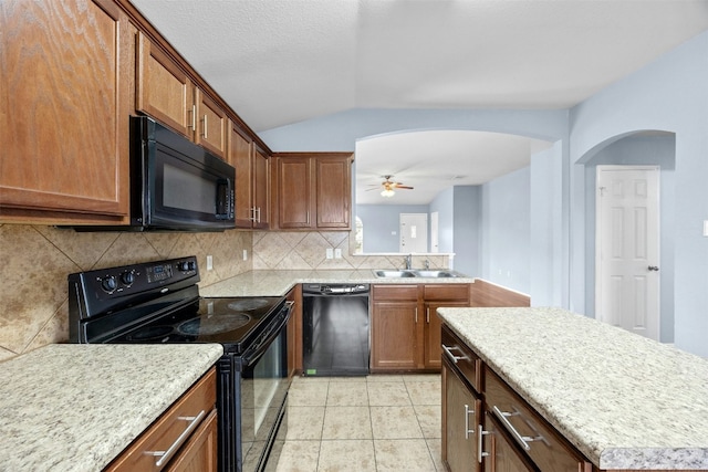 kitchen featuring ceiling fan, sink, backsplash, light tile patterned floors, and black appliances