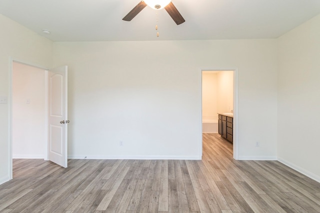 empty room with ceiling fan and light wood-type flooring