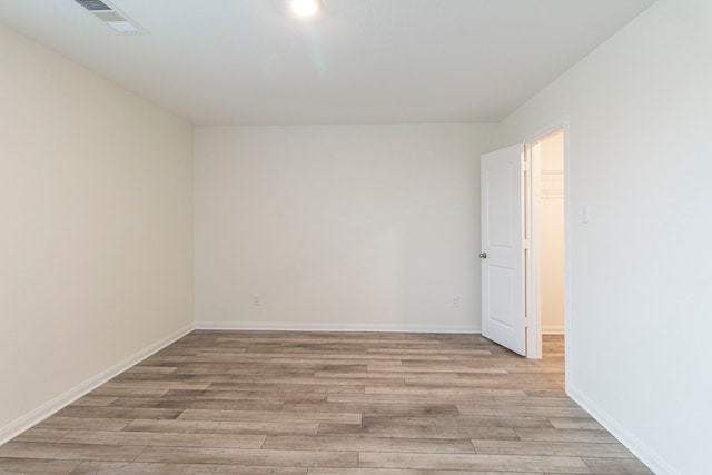 spare room featuring light wood-type flooring