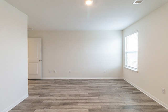 empty room with light wood-type flooring