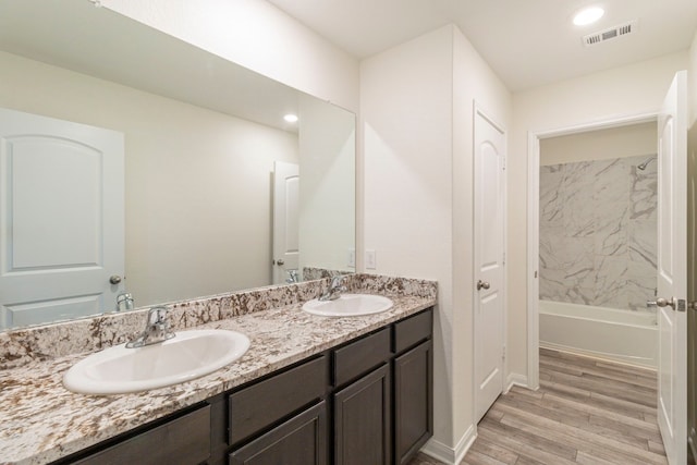 bathroom featuring vanity and hardwood / wood-style flooring