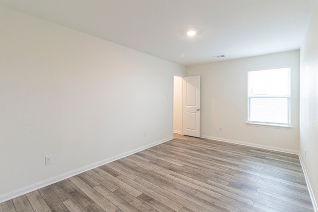 unfurnished room featuring light hardwood / wood-style floors