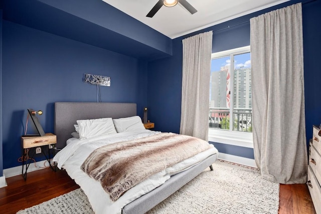 bedroom featuring hardwood / wood-style floors and ceiling fan