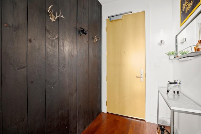 hall with dark wood-type flooring