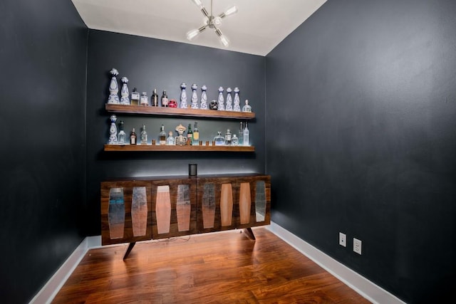 bar featuring hardwood / wood-style floors