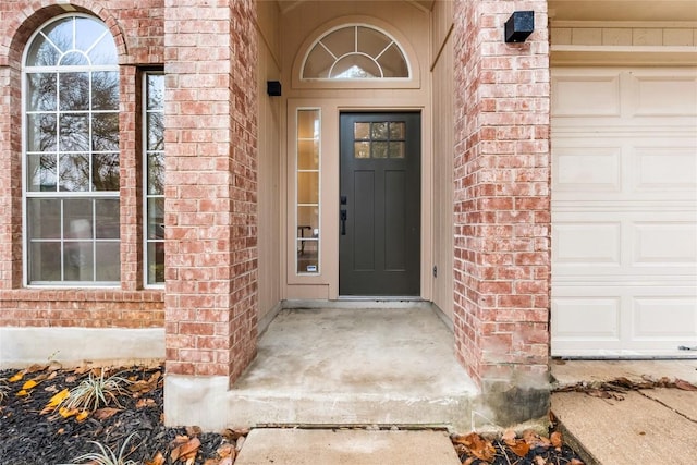 property entrance with a garage