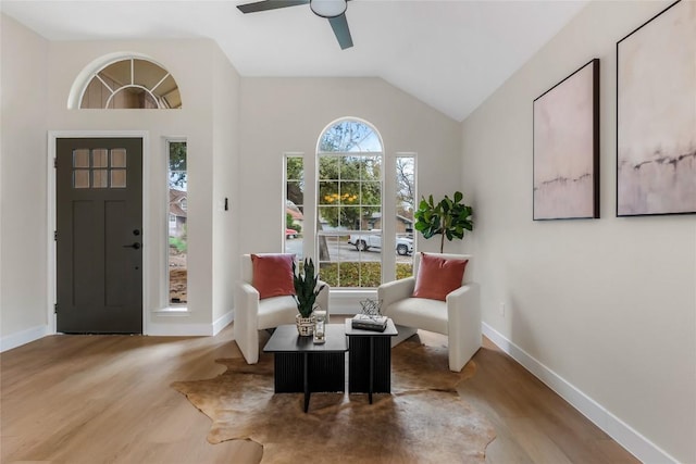 sitting room with vaulted ceiling, light hardwood / wood-style flooring, and ceiling fan