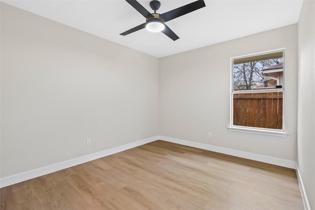 spare room with light hardwood / wood-style flooring and ceiling fan