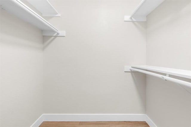 walk in closet featuring hardwood / wood-style floors