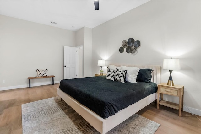 bedroom featuring ceiling fan and hardwood / wood-style flooring