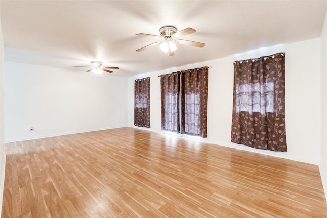 spare room featuring light wood-type flooring and ceiling fan