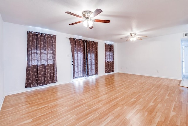 unfurnished room featuring ceiling fan and light hardwood / wood-style floors