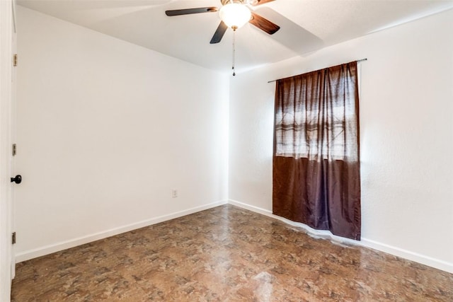 spare room with ceiling fan