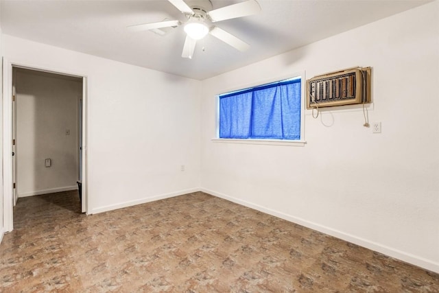 empty room featuring ceiling fan and an AC wall unit