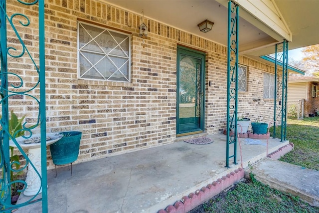 doorway to property with a porch