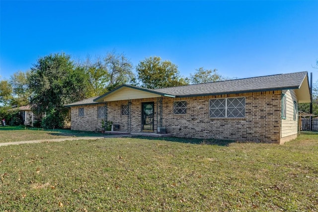 ranch-style home with a front lawn