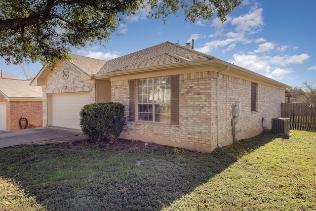 view of side of home featuring a lawn, cooling unit, and a garage