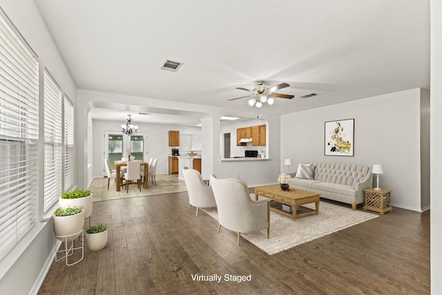 2110 Deer Creek Trl, Round Rock, TX 78665 - living area with wood finished floors, a chandelier, a ceiling fan, and baseboards