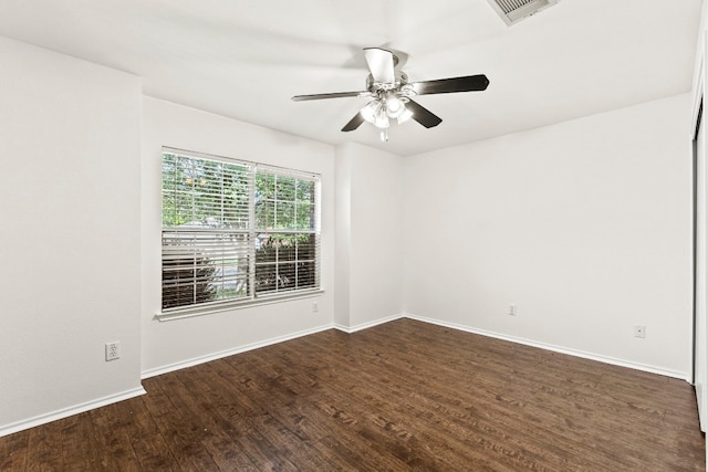 unfurnished room featuring ceiling fan and dark hardwood / wood-style floors