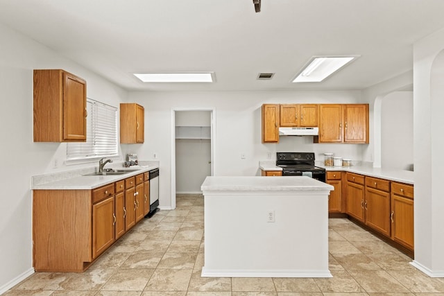 kitchen featuring electric range, dishwasher, a kitchen island, and sink