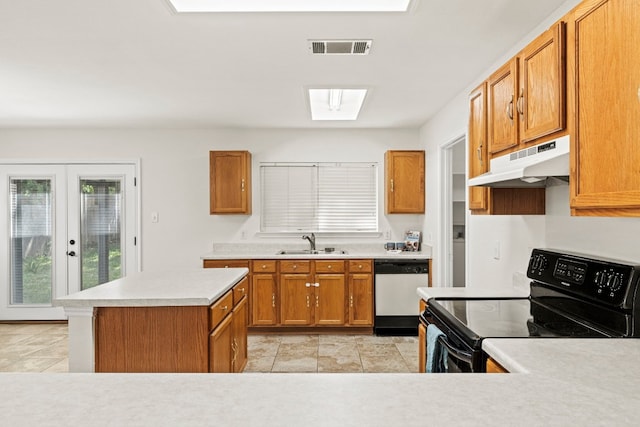 kitchen featuring a skylight, sink, french doors, black electric range oven, and dishwashing machine