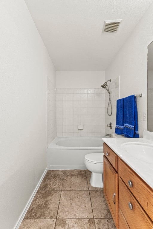 full bathroom with vanity, toilet, and tiled shower / bath combo