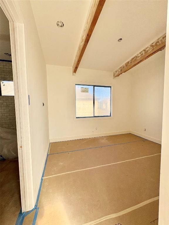 interior space featuring beam ceiling