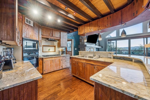 kitchen with stainless steel appliances, sink, wood-type flooring, wooden ceiling, and beamed ceiling