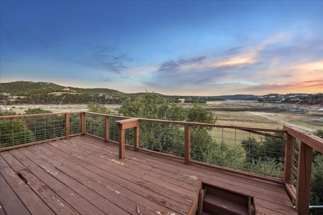 deck at dusk with a mountain view