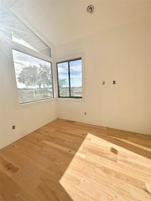 empty room featuring hardwood / wood-style flooring